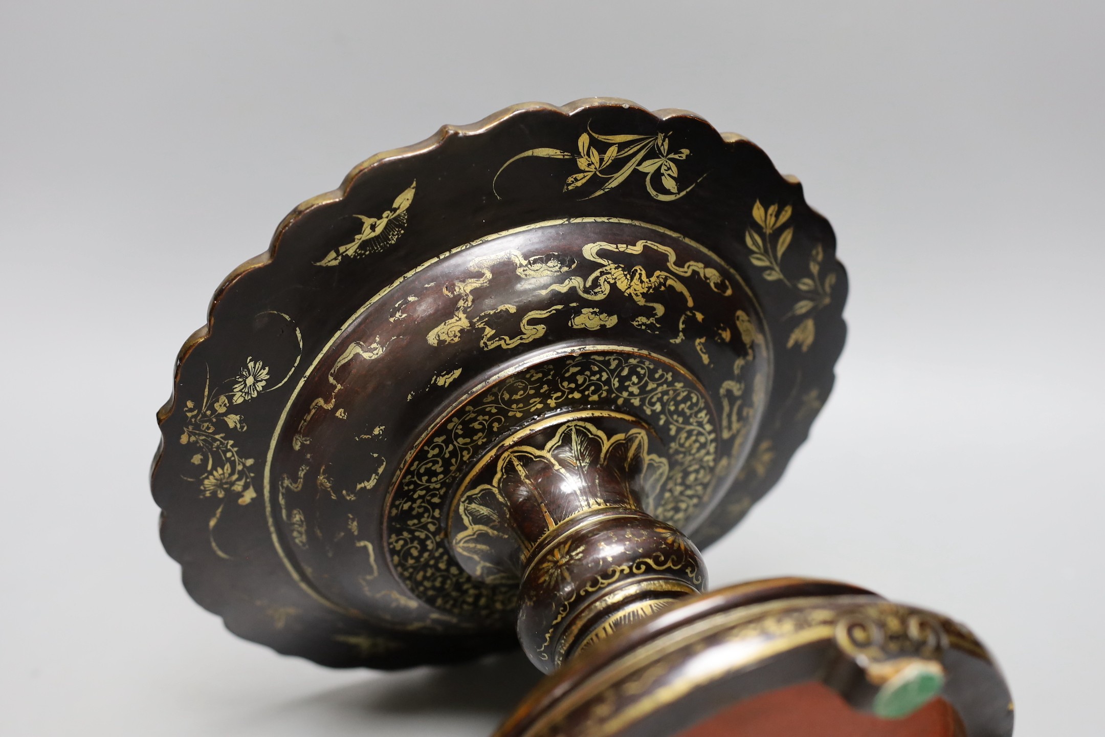 An 18th century Chinese lacquer pedestal dish, 23cm diameter